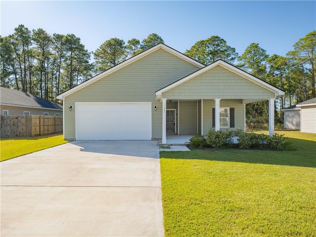 view of front of home with a garage, covered porch, and a front lawn