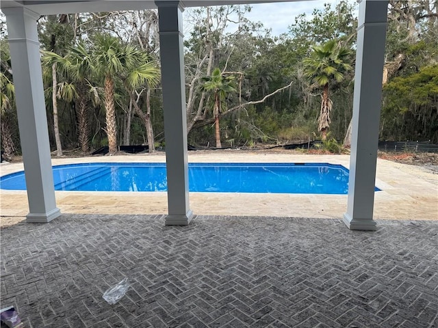 pool featuring a patio area