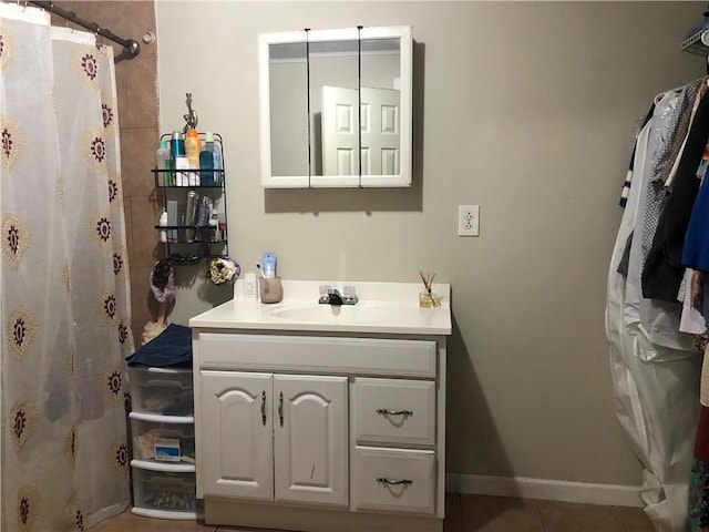 bathroom featuring a shower with shower curtain, vanity, and tile patterned floors