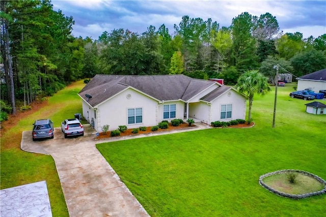 single story home featuring a front lawn