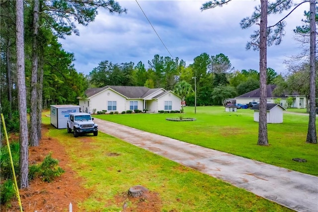 ranch-style house with a front yard and a shed