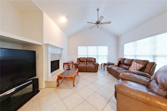 living room with ceiling fan, light tile patterned flooring, and high vaulted ceiling