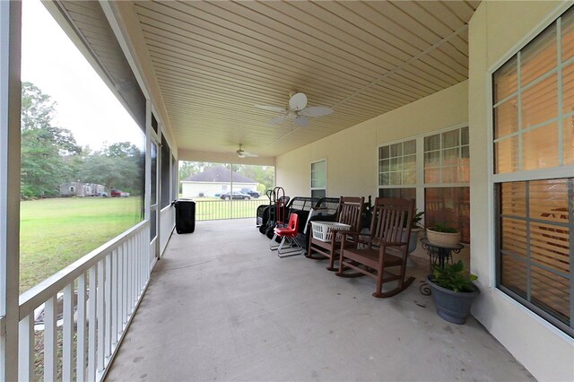 view of patio / terrace with ceiling fan and a porch