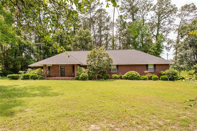 1709 Suwanne Dr, Waycross, GA 31501 - single story home featuring a front lawn, brick siding, and view of wooded area