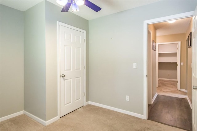 1709 Suwanne Dr, Waycross, GA 31501 - unfurnished bedroom with light colored carpet, baseboards, and a ceiling fan
