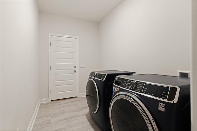 clothes washing area featuring independent washer and dryer