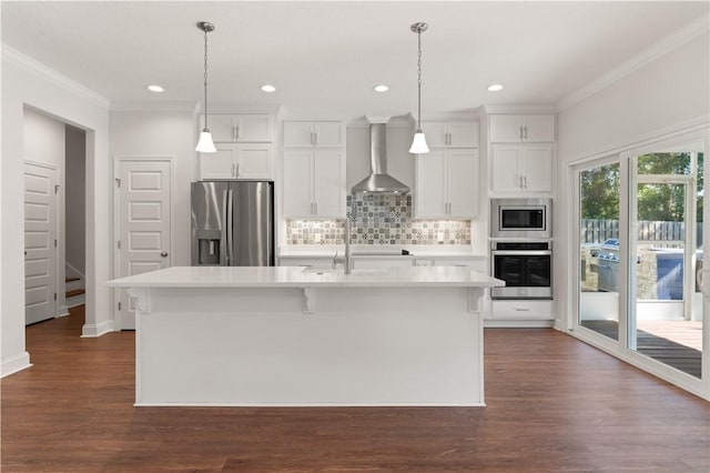 kitchen featuring wall chimney exhaust hood, dark hardwood / wood-style flooring, a center island with sink, white cabinets, and appliances with stainless steel finishes