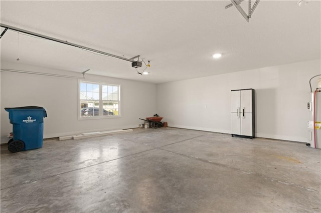 garage with a garage door opener and water heater