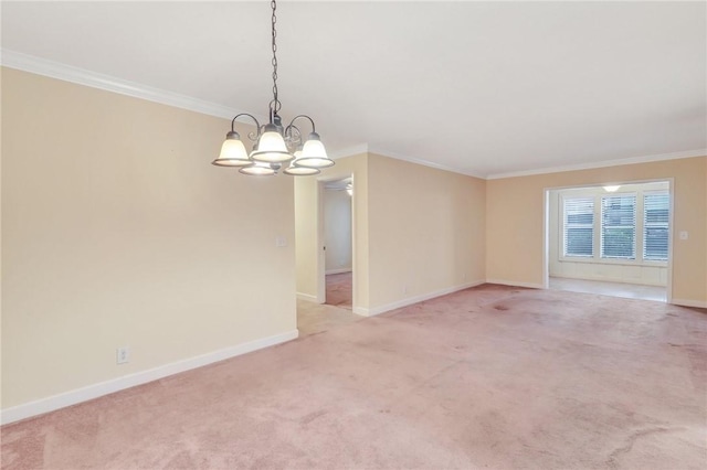 empty room featuring crown molding, baseboards, and light colored carpet