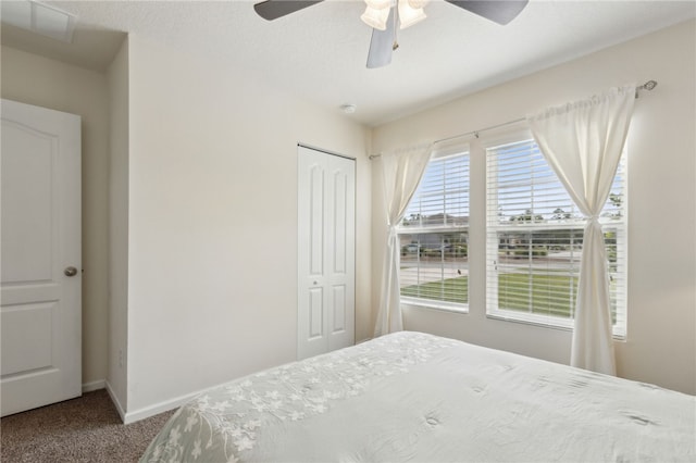 310 Brooklet Cir, Saint Marys, GA 31558 - carpeted bedroom with a closet, baseboards, and ceiling fan