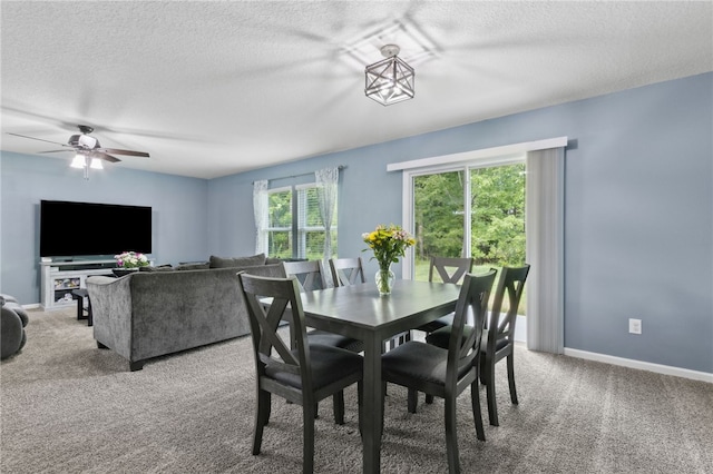 310 Brooklet Cir, Saint Marys, GA 31558 - carpeted dining area featuring a textured ceiling, ceiling fan, and baseboards