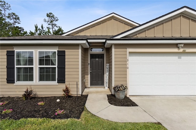 310 Brooklet Cir, Saint Marys, GA 31558 - view of front facade with board and batten siding, driveway, and a garage