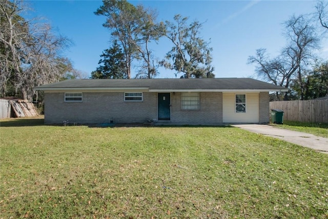 ranch-style home with brick siding, a front lawn, and fence