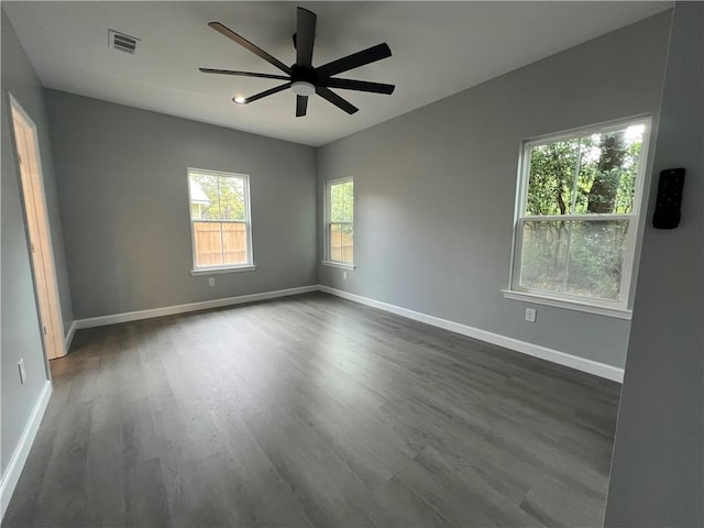 909 E Third St, Darien, GA 31305 - spare room with dark wood finished floors and ceiling fan