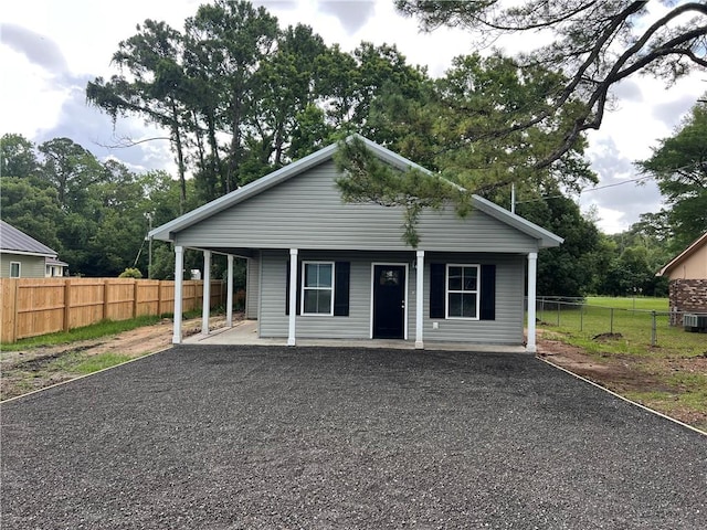 909 E Third St, Darien, GA 31305 - view of front of property featuring covered porch and gravel driveway