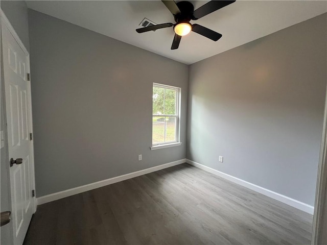 909 E Third St, Darien, GA 31305 - empty room featuring dark wood-style flooring and ceiling fan