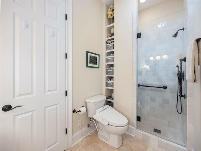 bathroom featuring tile patterned flooring, an enclosed shower, and toilet