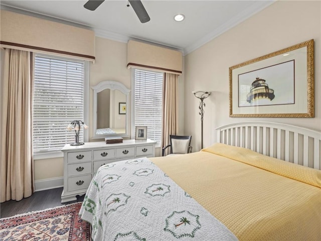 bedroom with crown molding, ceiling fan, and dark wood-type flooring