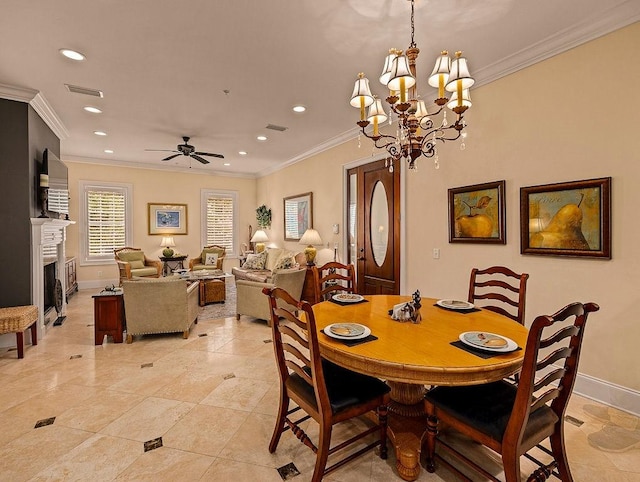 tiled dining room with ceiling fan with notable chandelier and ornamental molding