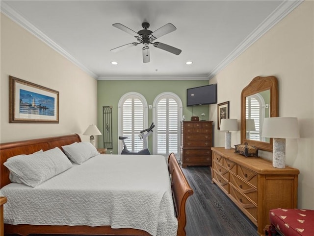 bedroom featuring dark wood-type flooring, ornamental molding, and ceiling fan