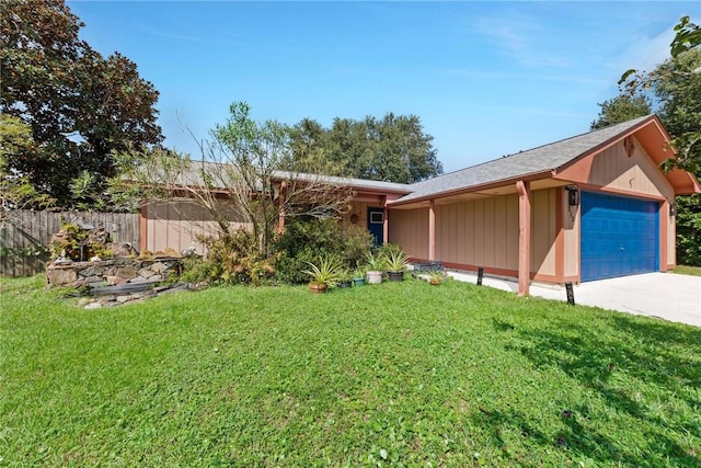 ranch-style house with a front lawn and a garage