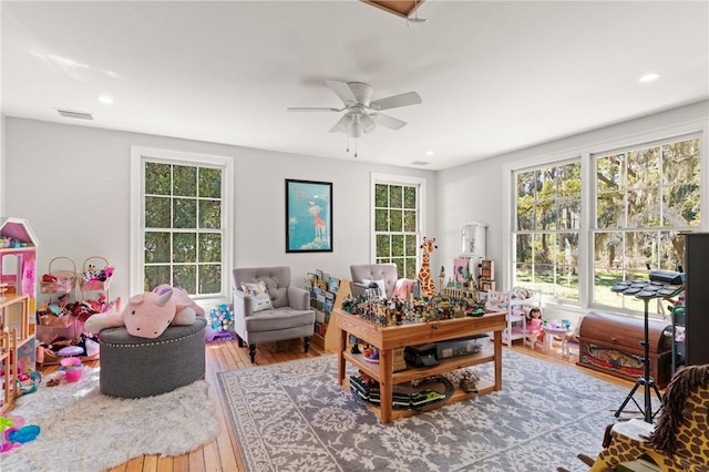 rec room with visible vents, recessed lighting, a ceiling fan, and wood-type flooring