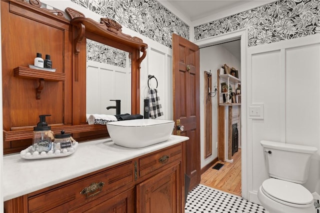 bathroom featuring vanity and toilet