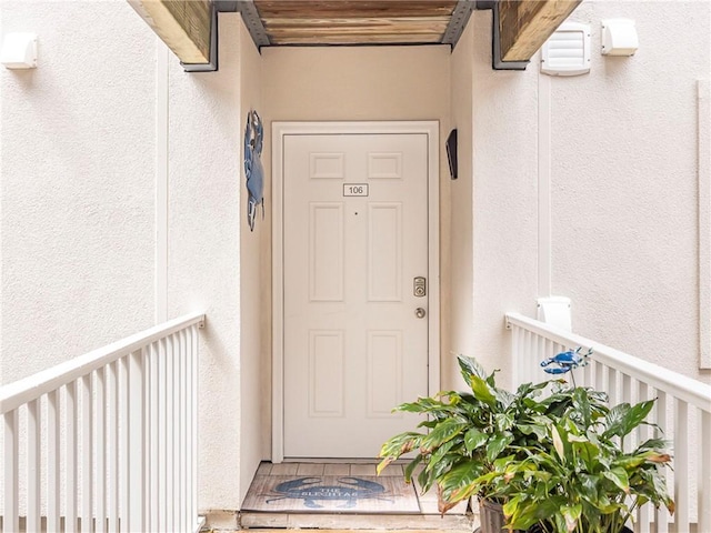 1524 Wood Ave Unit 106, Saint Simons Island, GA 31522 - entrance to property with a balcony and stucco siding