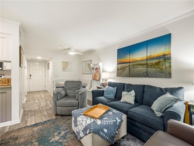 1524 Wood Ave Unit 106, Saint Simons Island, GA 31522 - living area featuring crown molding, ceiling fan, and wood finished floors