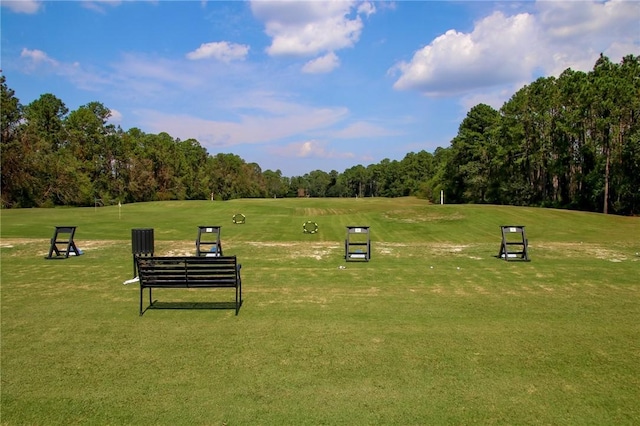 view of property's community with a lawn