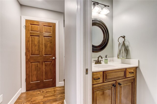 bathroom featuring hardwood / wood-style flooring and vanity