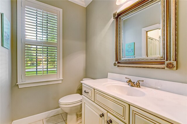 bathroom featuring tile patterned floors, vanity, and toilet