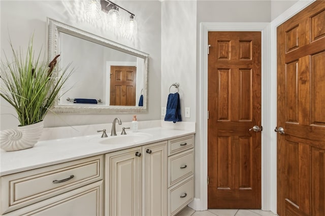 bathroom with tile patterned floors and vanity