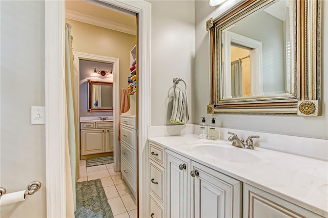 bathroom with tile patterned floors, vanity, and crown molding