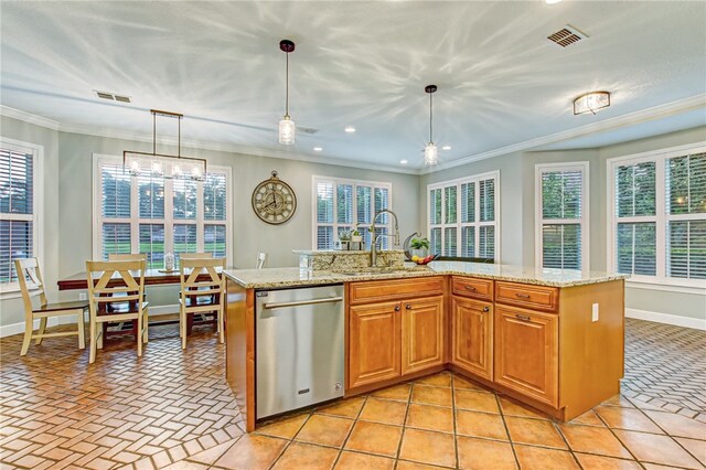 kitchen featuring hanging light fixtures, an island with sink, stainless steel dishwasher, and sink