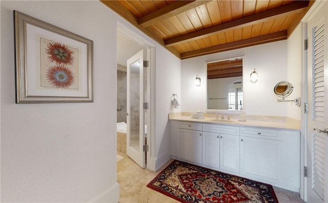 bathroom with tile patterned flooring, beamed ceiling, vanity, and wooden ceiling