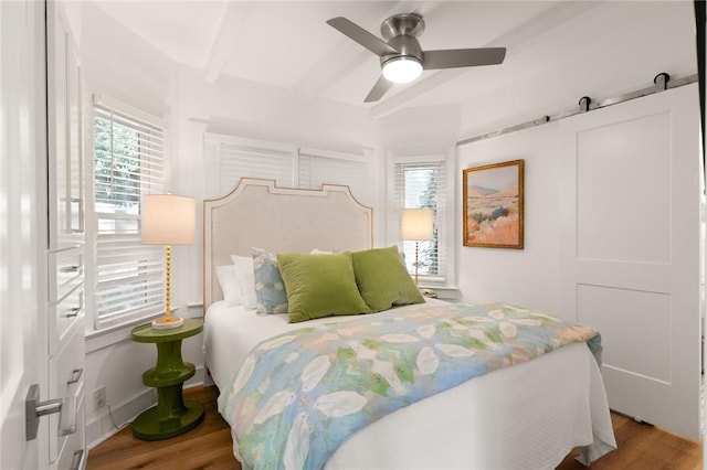 108 Hamilton St, Saint Simons Island, GA 31522 - bedroom with wood finished floors, beam ceiling, and ceiling fan