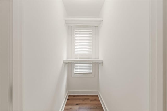 108 Hamilton St, Saint Simons Island, GA 31522 - walk in closet featuring wood finished floors