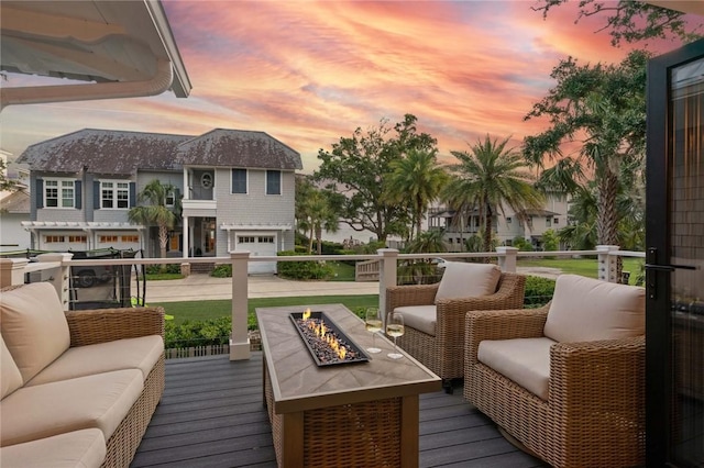 108 Hamilton St, Saint Simons Island, GA 31522 - deck at dusk with an outdoor living space with a fire pit