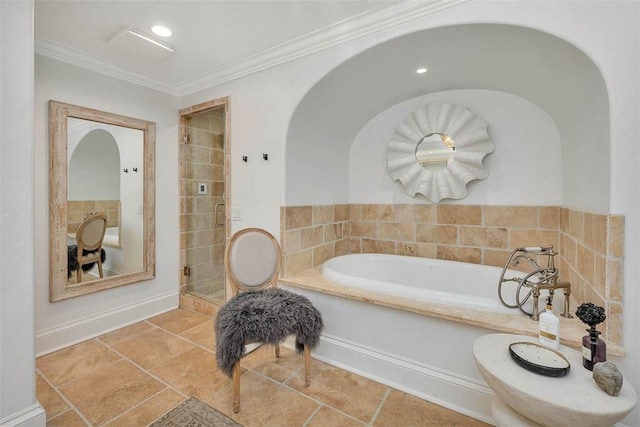 bathroom with tile patterned flooring, a bathtub, and ornamental molding