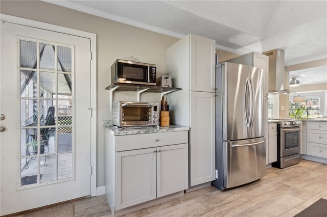 15 Merganser Way, Woodbine, GA 31569 - kitchen with extractor fan, a toaster, crown molding, and stainless steel appliances
