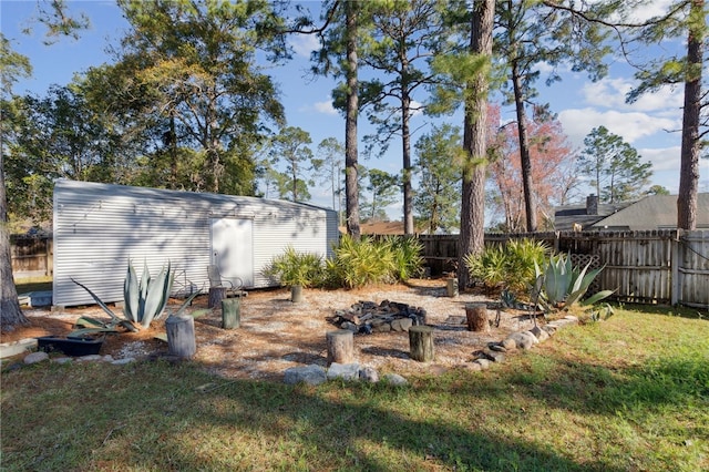 15 Merganser Way, Woodbine, GA 31569 - view of yard featuring an outdoor structure and fence