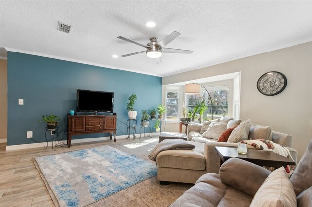 15 Merganser Way, Woodbine, GA 31569 - living area with crown molding, visible vents, and baseboards