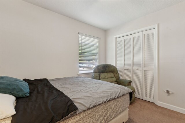 15 Merganser Way, Woodbine, GA 31569 - bedroom featuring a closet, baseboards, and carpet flooring