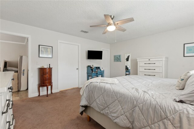 15 Merganser Way, Woodbine, GA 31569 - bedroom with baseboards, visible vents, ceiling fan, a textured ceiling, and light carpet