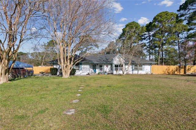 15 Merganser Way, Woodbine, GA 31569 - exterior space with a front lawn and fence