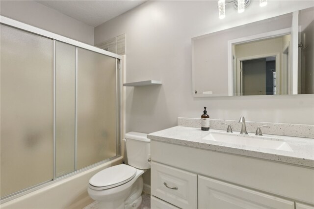 15 Merganser Way, Woodbine, GA 31569 - full bath with toilet, vanity, and shower / bath combination with glass door