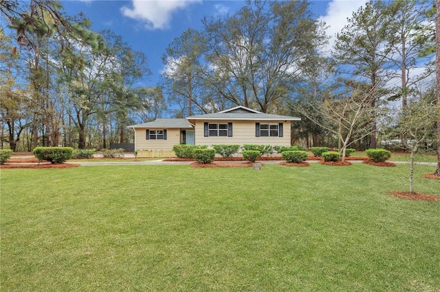 ranch-style house with a front lawn