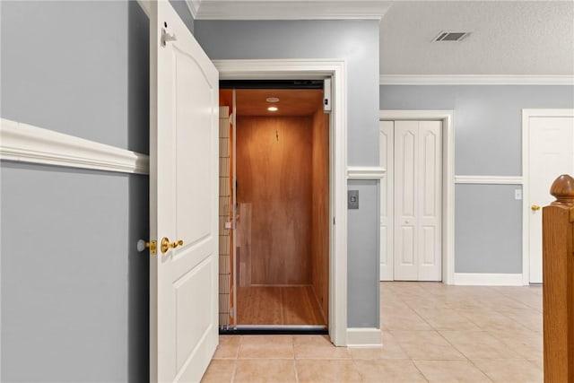 142 Montrose, Saint Simons Island, GA 31522 - hall with elevator, light tile patterned flooring, ornamental molding, and baseboards