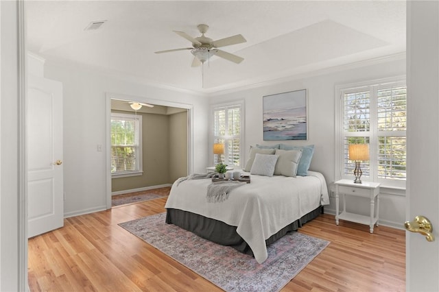 142 Montrose, Saint Simons Island, GA 31522 - bedroom featuring crown molding, light wood finished floors, baseboards, and a ceiling fan